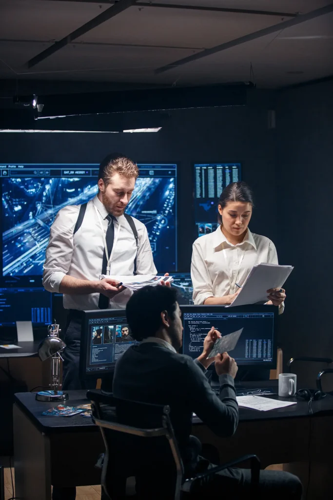 a group of three cyber security professionals working