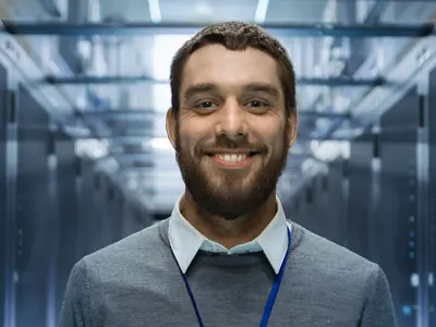 tech professional smiling at camera